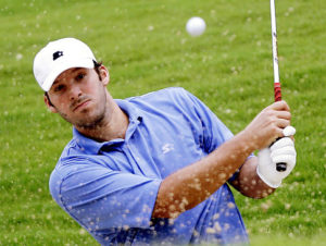 Dallas Cowboys quarterback Tony Romo hits out of a bunker on the fourth hole during sectional qualifying for the 2010 U.S. Open golf touranment Monday, June 7, 2010 at the Club at Carlton Woods in The Woodlands, Texas. The U.S. Open will be played June 14-20 at Pebble Beach Golf Links in Pebble Beach, Calif. (AP Photo/David J. Phillip) Original Filename: Romo_US_Open_Qualifing_Golf_Football_TXDP109.jpg