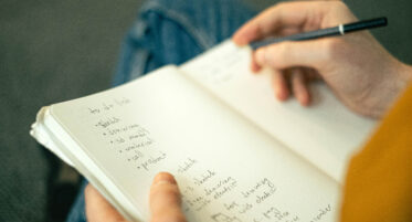 header image of a person writing in a notebook their likes and dislikes